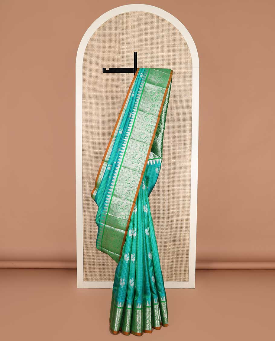 Green checked and zari buttas Kanchipuram silk saree, contrast border of rekku, salngai, muthu, chakram, kili designs, and jaal pallu