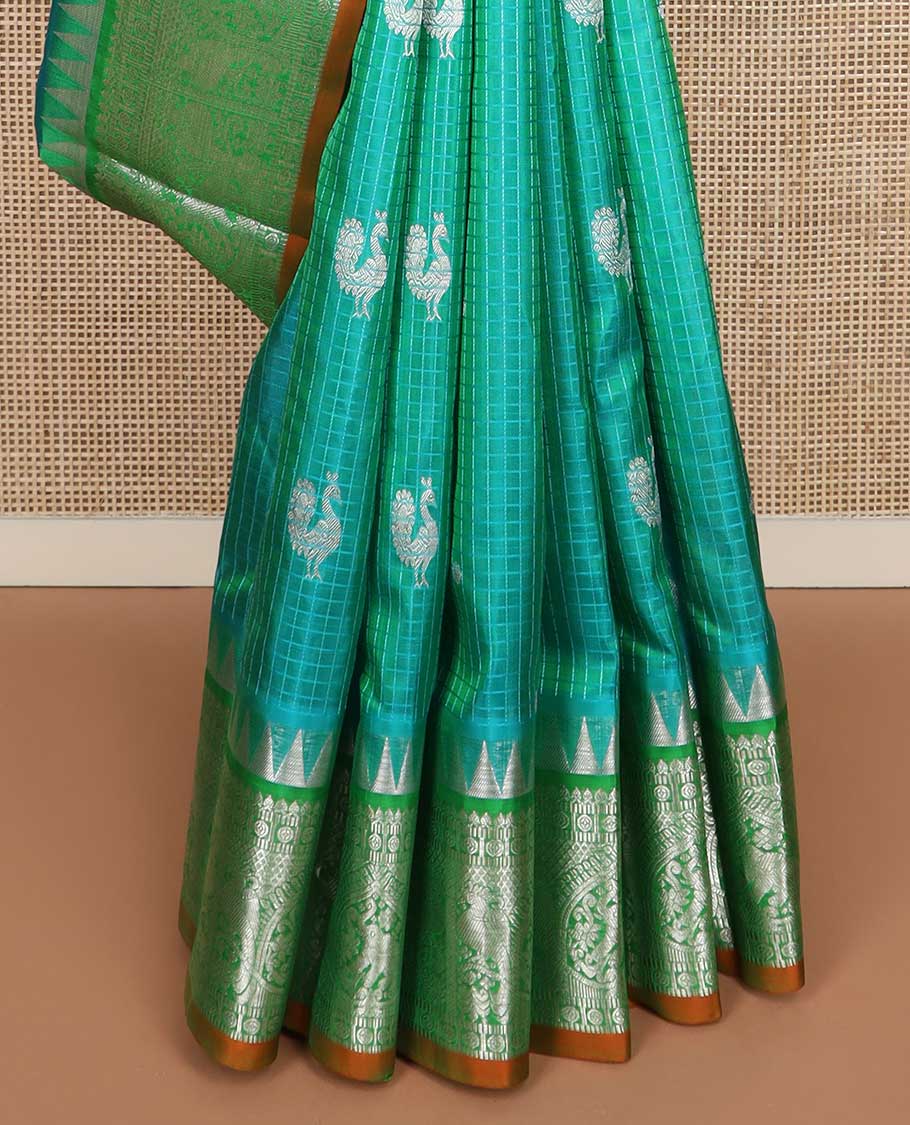 Green checked and zari buttas Kanchipuram silk saree, contrast border of rekku, salngai, muthu, chakram, kili designs, and jaal pallu