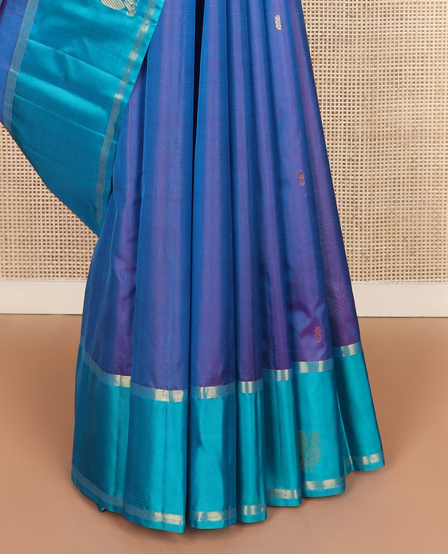 Blue zari buttas Kanchipuram silk saree, contrast mayil yaanai motifs woven border, and zari design pallu
