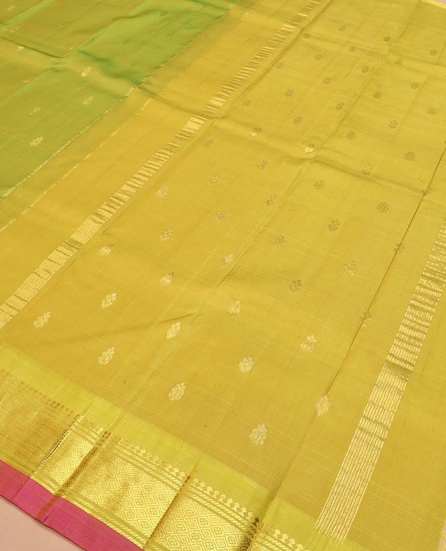 Green zari buttas Kanchipuram silk saree, contrast one-sided border of paneer sombu, banaras, and jaal designs, and zari design pallu