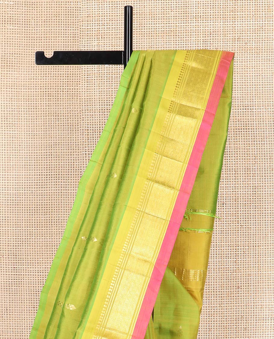 Green zari buttas Kanchipuram silk saree, contrast one-sided border of paneer sombu, banaras, and jaal designs, and zari design pallu