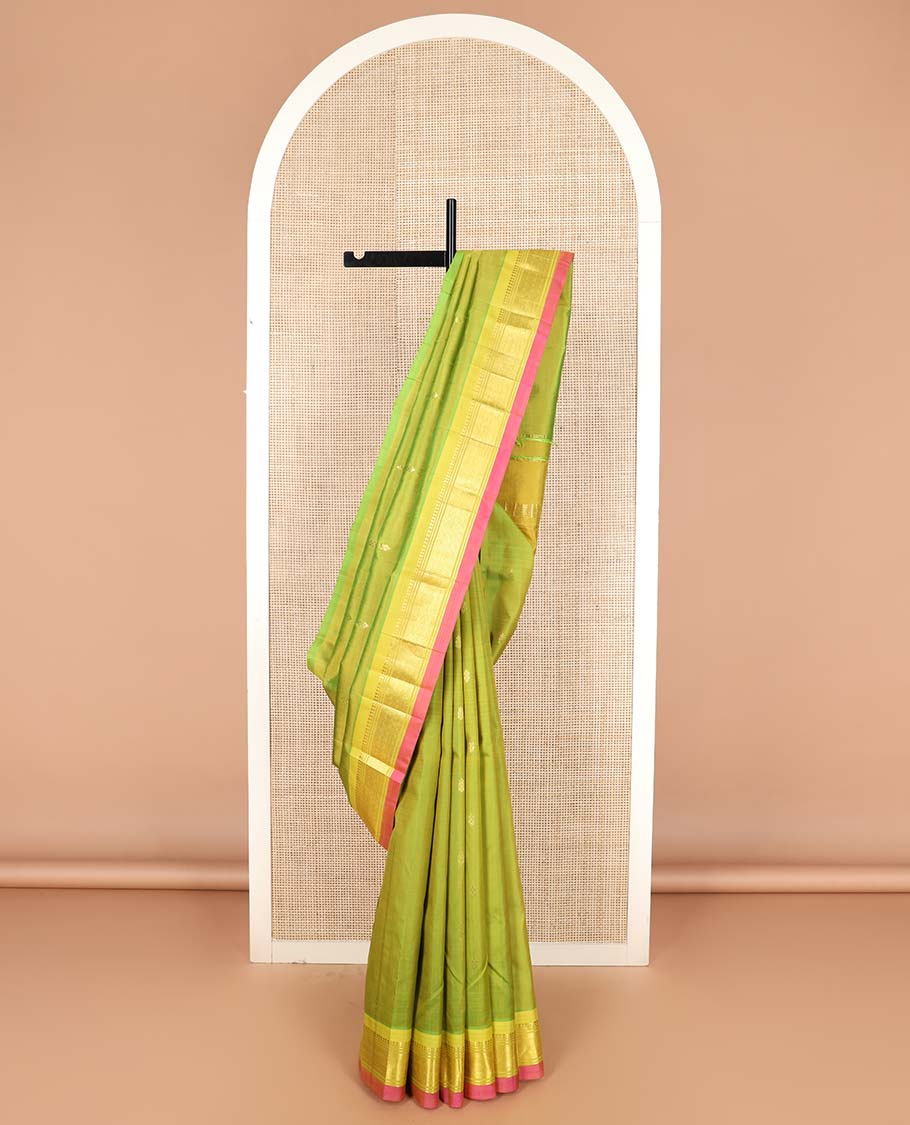Green zari buttas Kanchipuram silk saree, contrast one-sided border of paneer sombu, banaras, and jaal designs, and zari design pallu