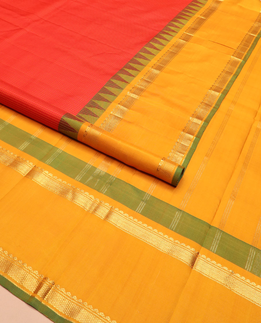 Red micro-checked Kanchipuram silk saree, contrast rettai pettu border of thilakam mokku, banaras, and kuyil kann designs, and zari striped pallu