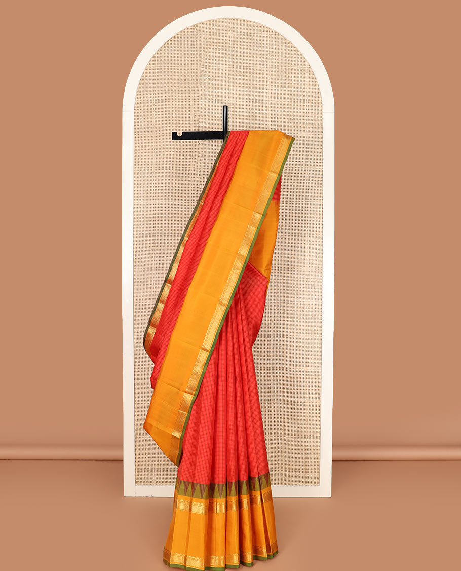 Red micro-checked Kanchipuram silk saree, contrast rettai pettu border of thilakam mokku, banaras, and kuyil kann designs, and zari striped pallu