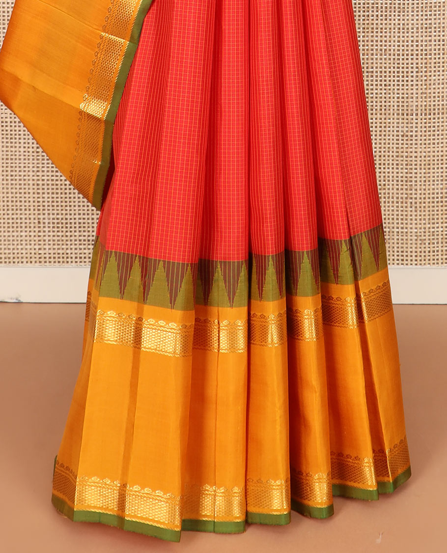 Red micro-checked Kanchipuram silk saree, contrast rettai pettu border of thilakam mokku, banaras, and kuyil kann designs, and zari striped pallu