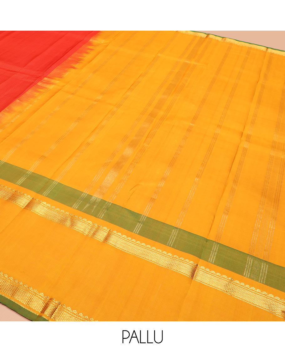 Red micro-checked Kanchipuram silk saree, contrast rettai pettu border of thilakam mokku, banaras, and kuyil kann designs, and zari striped pallu