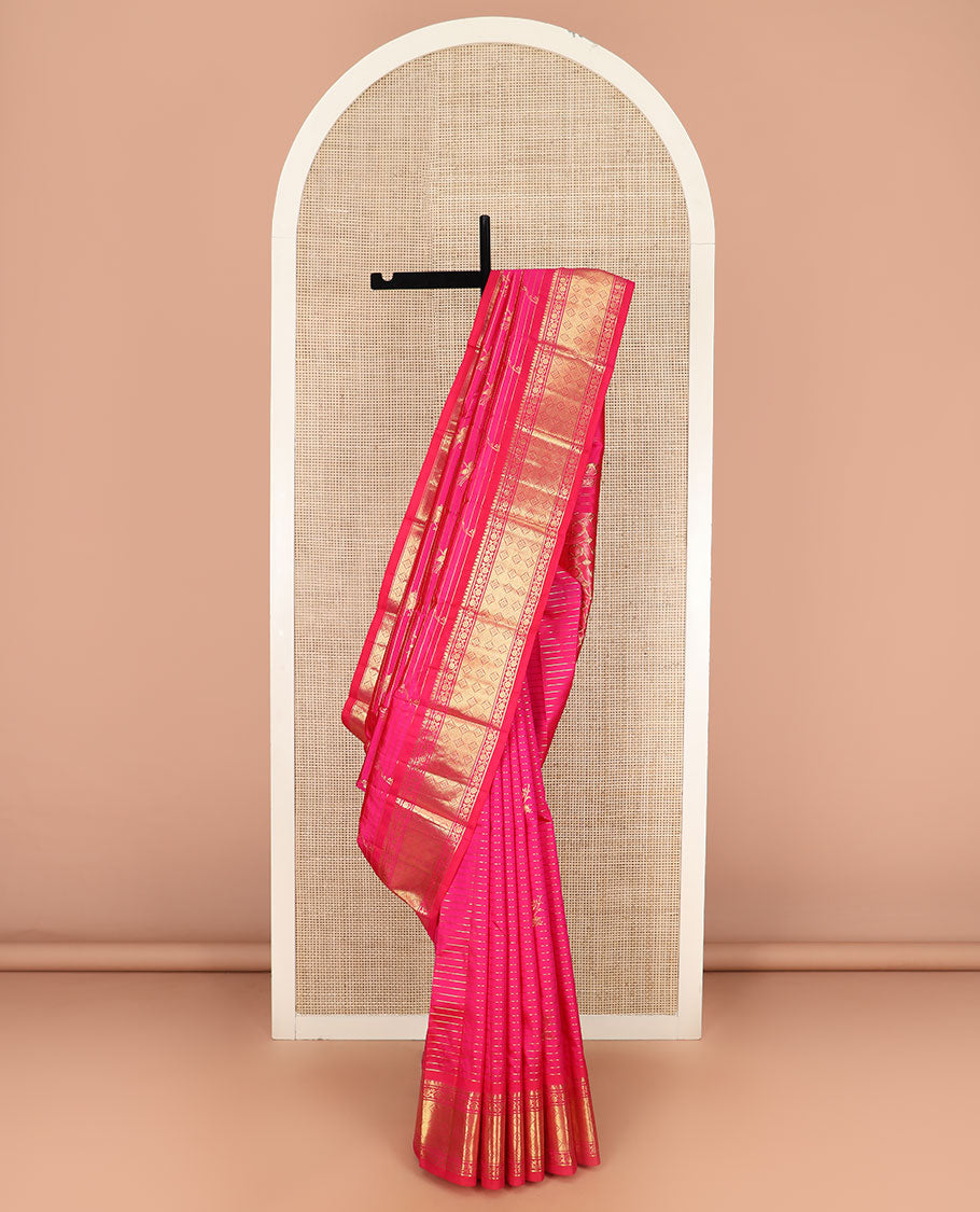 Rani Pink Kanchipuram Silk Saree Graced with Mayil Buttas and Zari Stripes All Over Its Body, Complemented by Contrast One-Sided Border of Kodi Visiry and Jaal Designs, Grandly Woven Pallu of Geometric Patterns, and Comes Without a Blouse