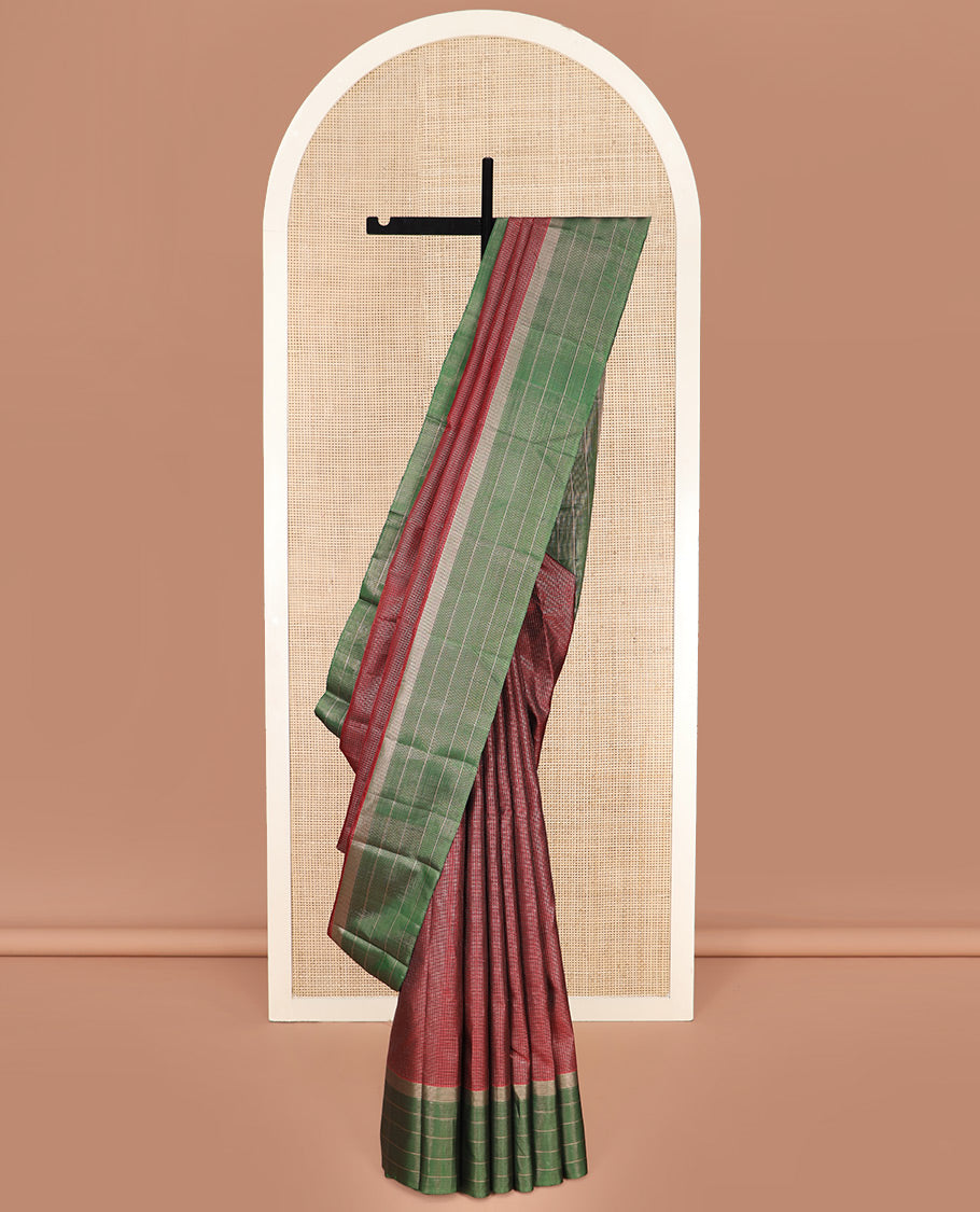 Maroon Kanchipuram Silk Saree Spotlighted Kasa Kasa Checks All Over Its Body, Complemented by a Contrast Border of Zari Stripes, Featuring Pallu of Seppu Rekku Designs, and Paired with a Contrast Blouse