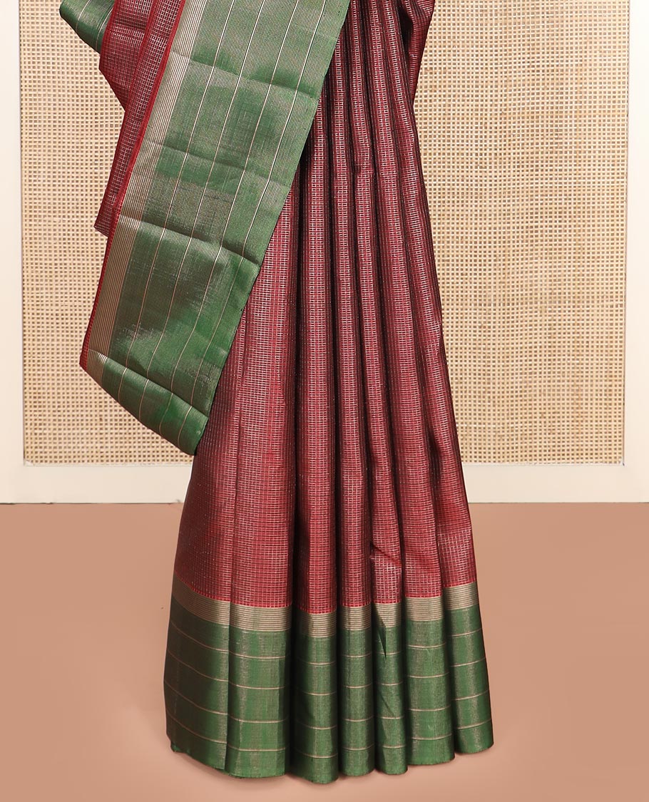 Maroon Kanchipuram Silk Saree Spotlighted Kasa Kasa Checks All Over Its Body, Complemented by a Contrast Border of Zari Stripes, Featuring Pallu of Seppu Rekku Designs, and Paired with a Contrast Blouse
