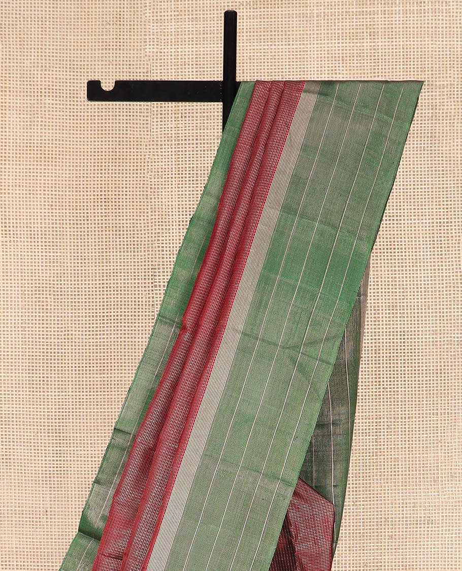 Maroon Kanchipuram Silk Saree Spotlighted Kasa Kasa Checks All Over Its Body, Complemented by a Contrast Border of Zari Stripes, Featuring Pallu of Seppu Rekku Designs, and Paired with a Contrast Blouse