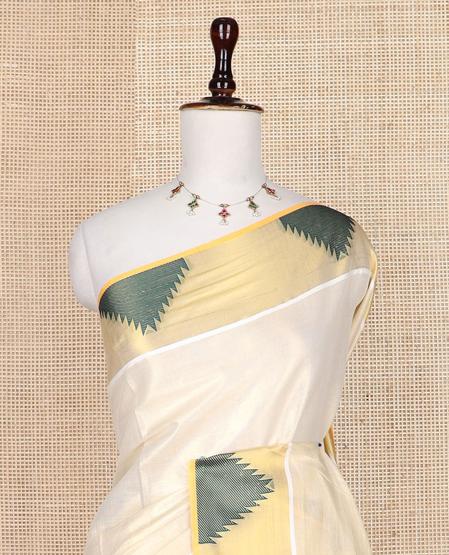 Gold plain design Kerala saree, thread temple motifs border, and zari woven pallu