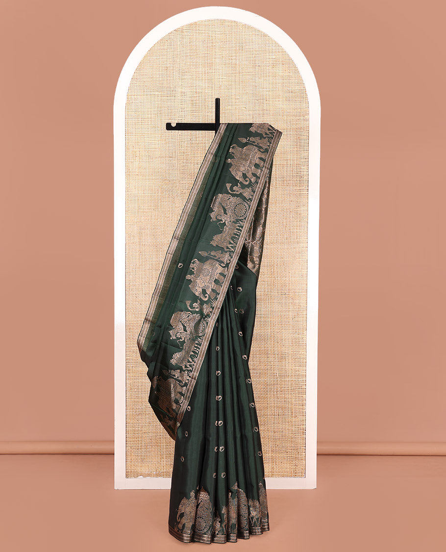 Green Mayuri Soft Silk Saree, Richly Detailed with Ring Buttas All Over Its Body, Highlighted by a Zari Border of Wedding-Style Bride and Groom Motifs Weave, Sparsely Woven Pallu with Wedding-Related Motifs, and Paired with a Matching Blouse