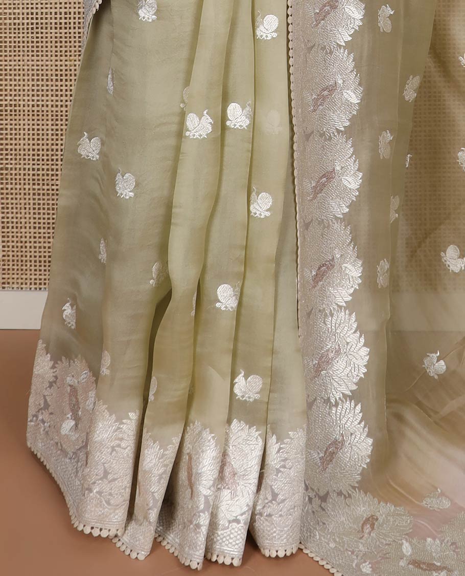 Mint green floral design organza saree with lace border