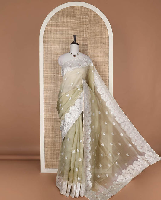 Mint green floral design organza saree with lace border