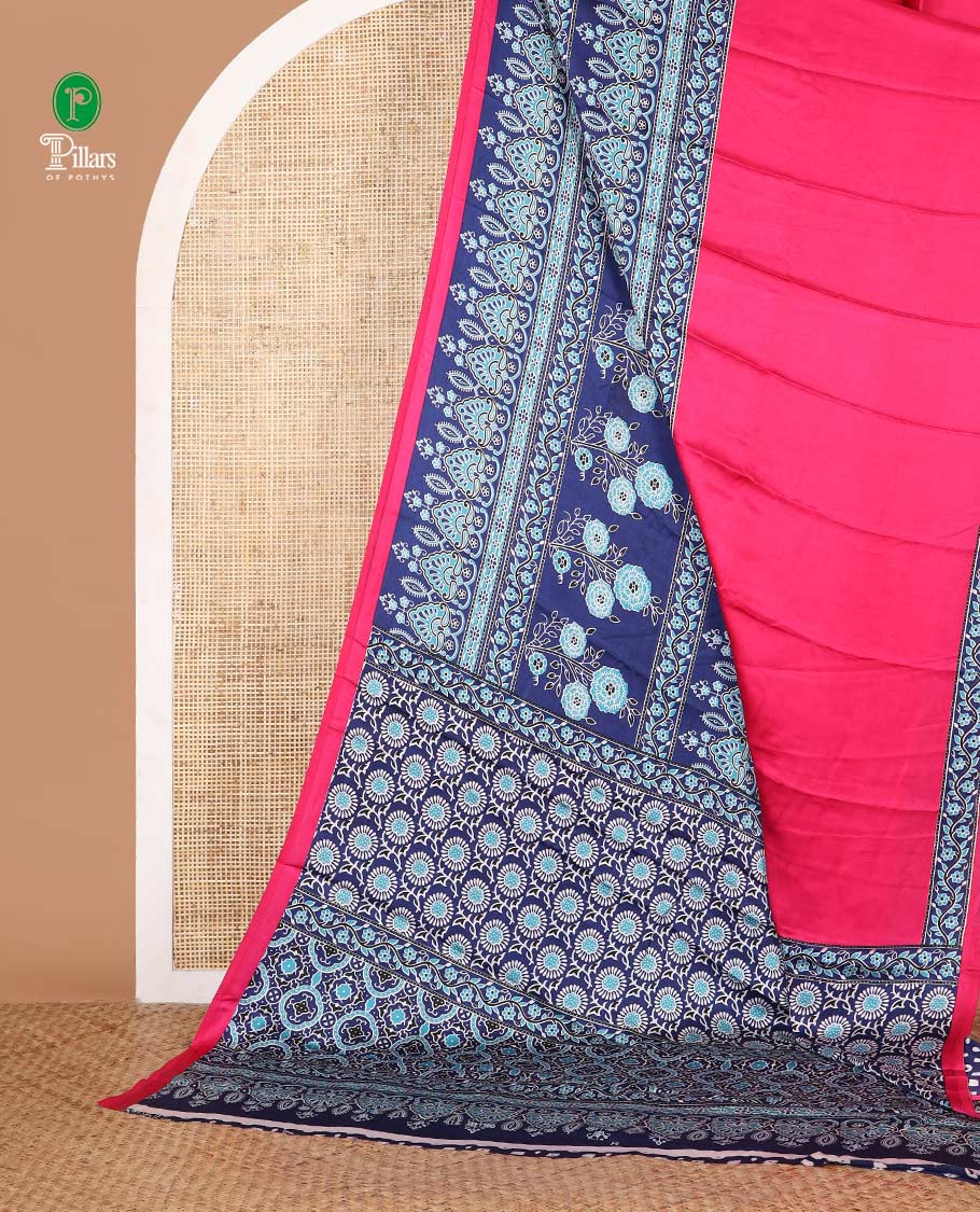 Pink half-plain & half-printed gajji silk saree, contrast blue border & pallu of ajrakh-print with printed blouse