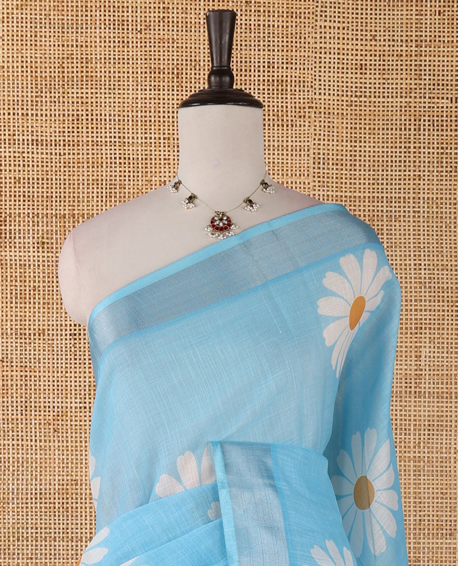 Sky blue sunflower motif printed linen saree, silver zari plain border & small sunflower motif print blouse