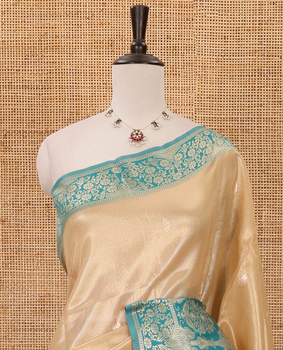 Cream color Antique buttas twill tissue saree, contrast satin thread woven border & pallu of mughal-style motifs & buttas green blouse