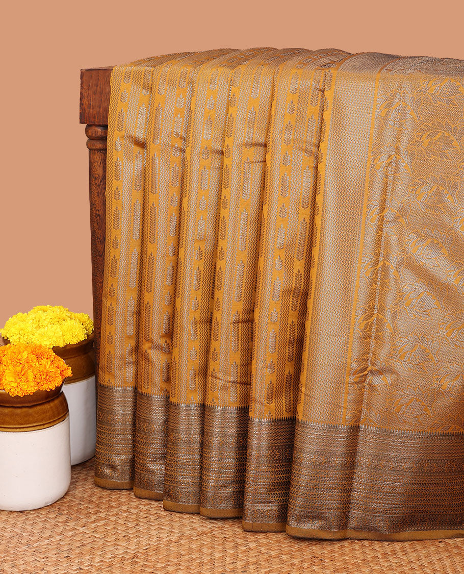 Mustard zig zag straight line leaf design elite silk saree, gold rose zari with veldari border , malli mokku design & rich pallu , rose gold brocade design blouse
