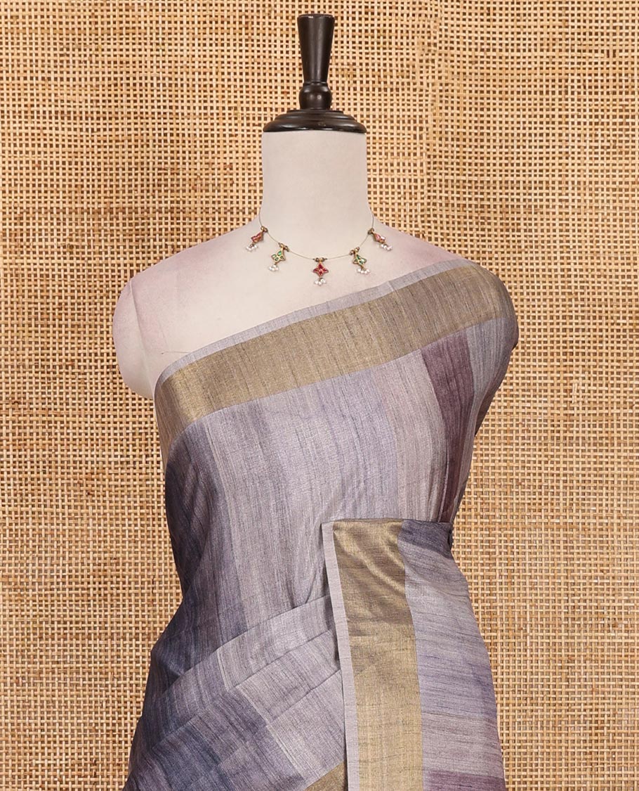 Grey vertical stripes printed hand-brush dyed Katan silk saree, gold zari bavanji border, Madhubani-style human figurines printed pallu, and floral printed blouse