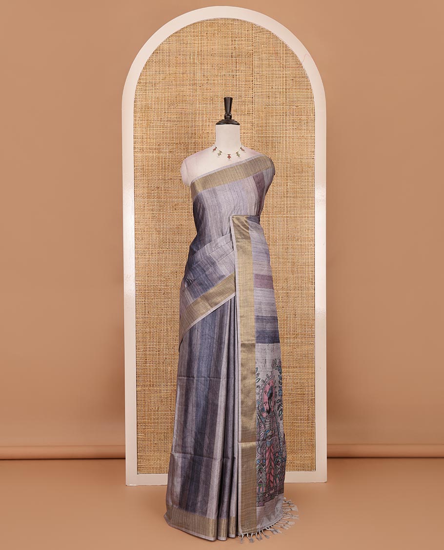 Grey vertical stripes printed hand-brush dyed Katan silk saree, gold zari bavanji border, Madhubani-style human figurines printed pallu, and floral printed blouse