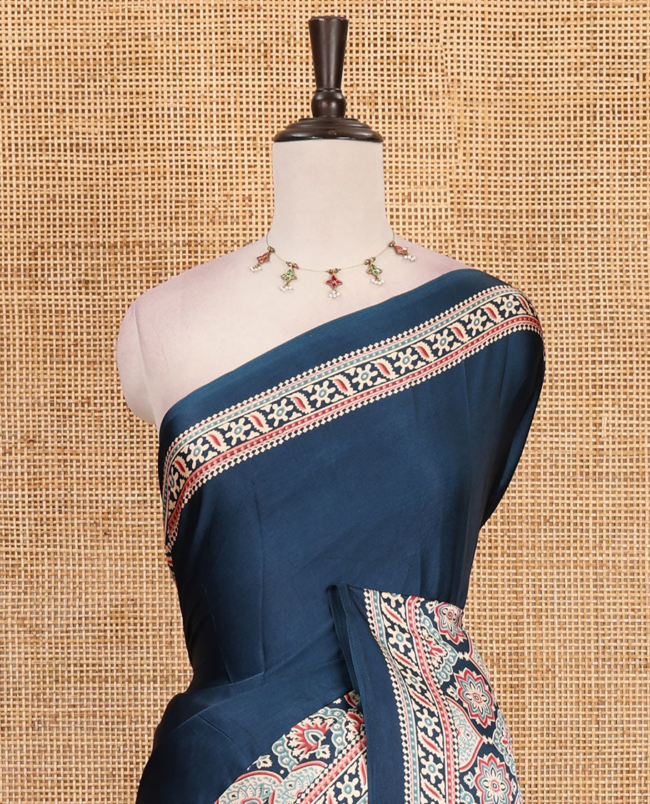 Blue plain gajji silk saree with ajrak printed border, ajrak printed geometric pallu, and printed blouse