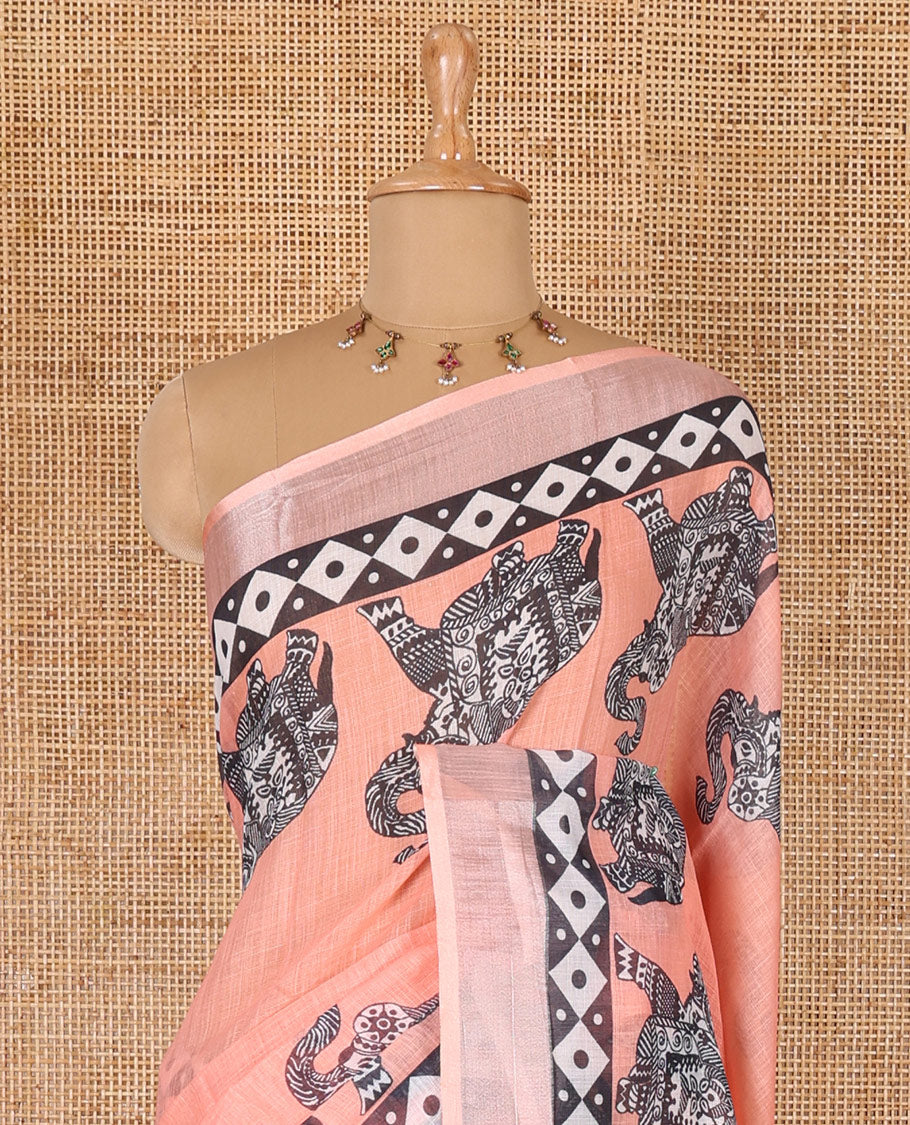 Orange plain linen cotton saree, silver zari border of elephant motifs print, elephant motifs pallu, and a contrast elephant motifs printed blouse