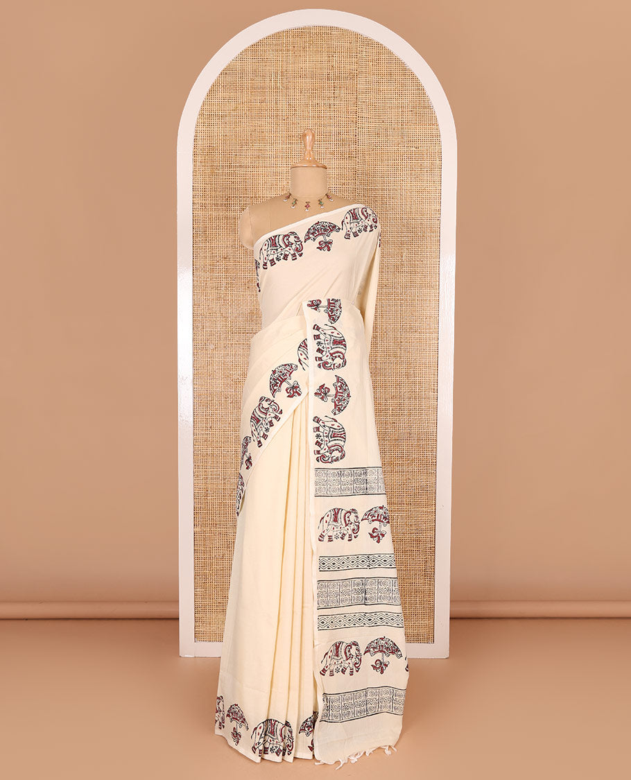 Cream plain South cotton saree, umbrella, and elephant motifs block printed border, block printed pallu, a matching blouse and a contrast floral vine block printed blouse