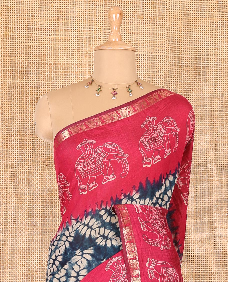 Blue shibori printed muslin cotton saree, contrast zari border of elephant motifs print, big elephant printed pallu, and a contrast printed blouse