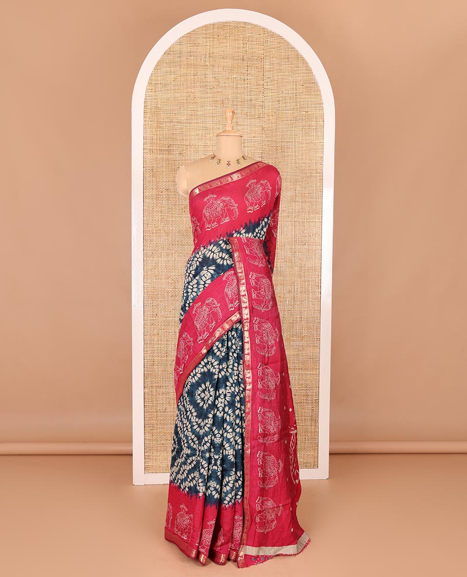 Blue shibori printed muslin cotton saree, contrast zari border of elephant motifs print, big elephant printed pallu, and a contrast printed blouse