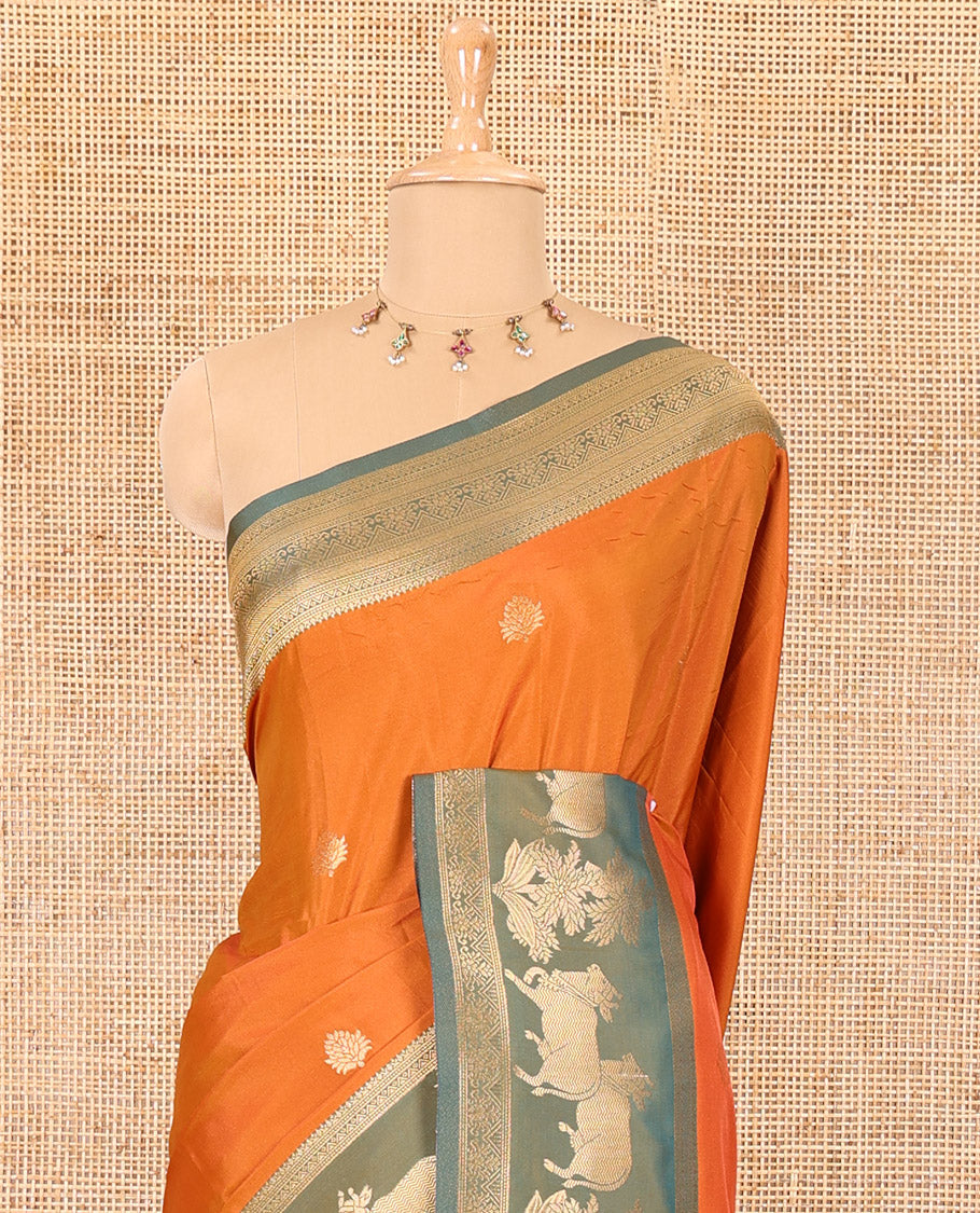 Orange zari buttas elite soft silk saree, contrast traditional zari border of Pichwai cow design, scallop pallu, and a contrast zari design blouse