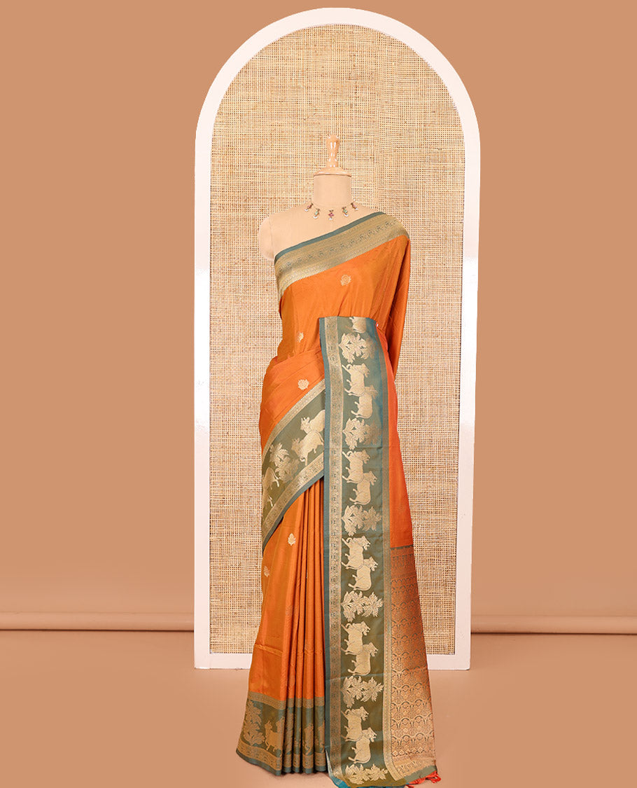 Orange zari buttas elite soft silk saree, contrast traditional zari border of Pichwai cow design, scallop pallu, and a contrast zari design blouse