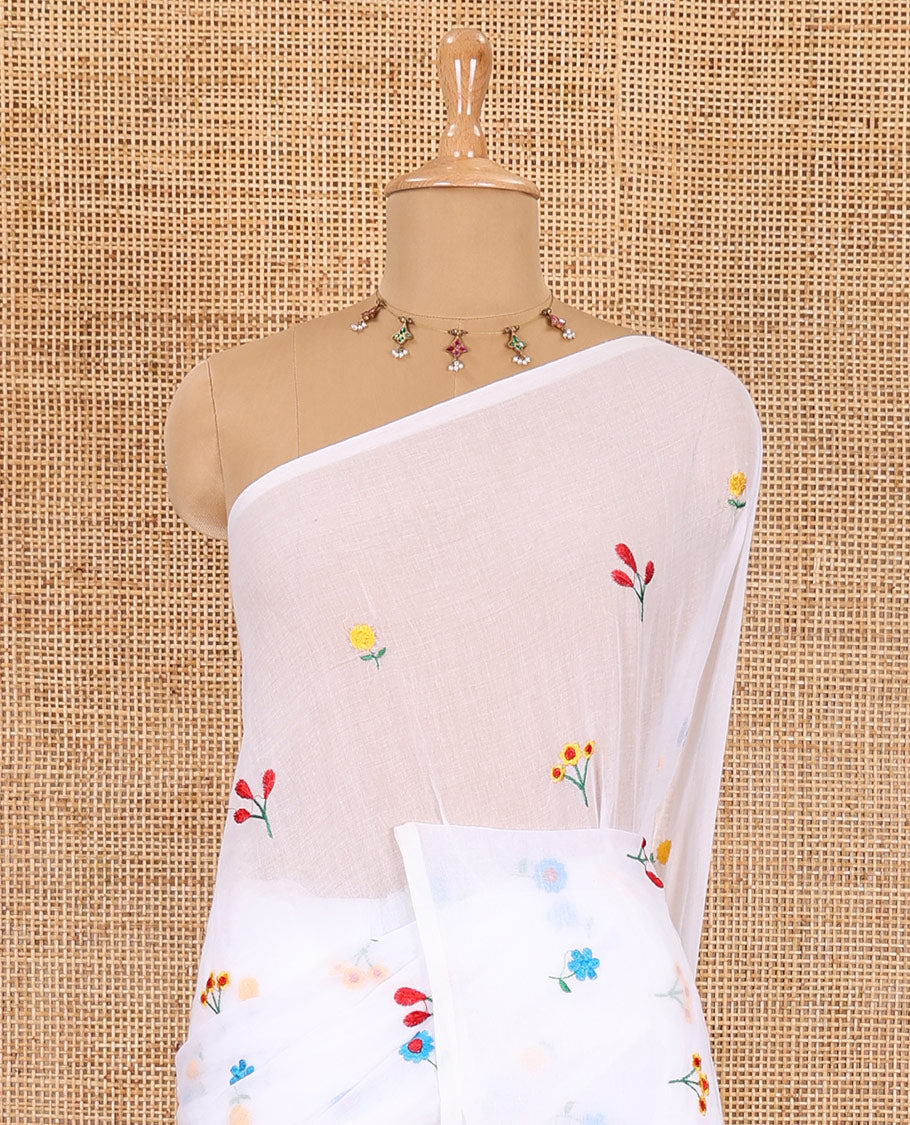 Borderless white floral motifs thread embroidered khadi mul cotton saree, floral motifs thread embroidered pallu, and a matching plain blouse
