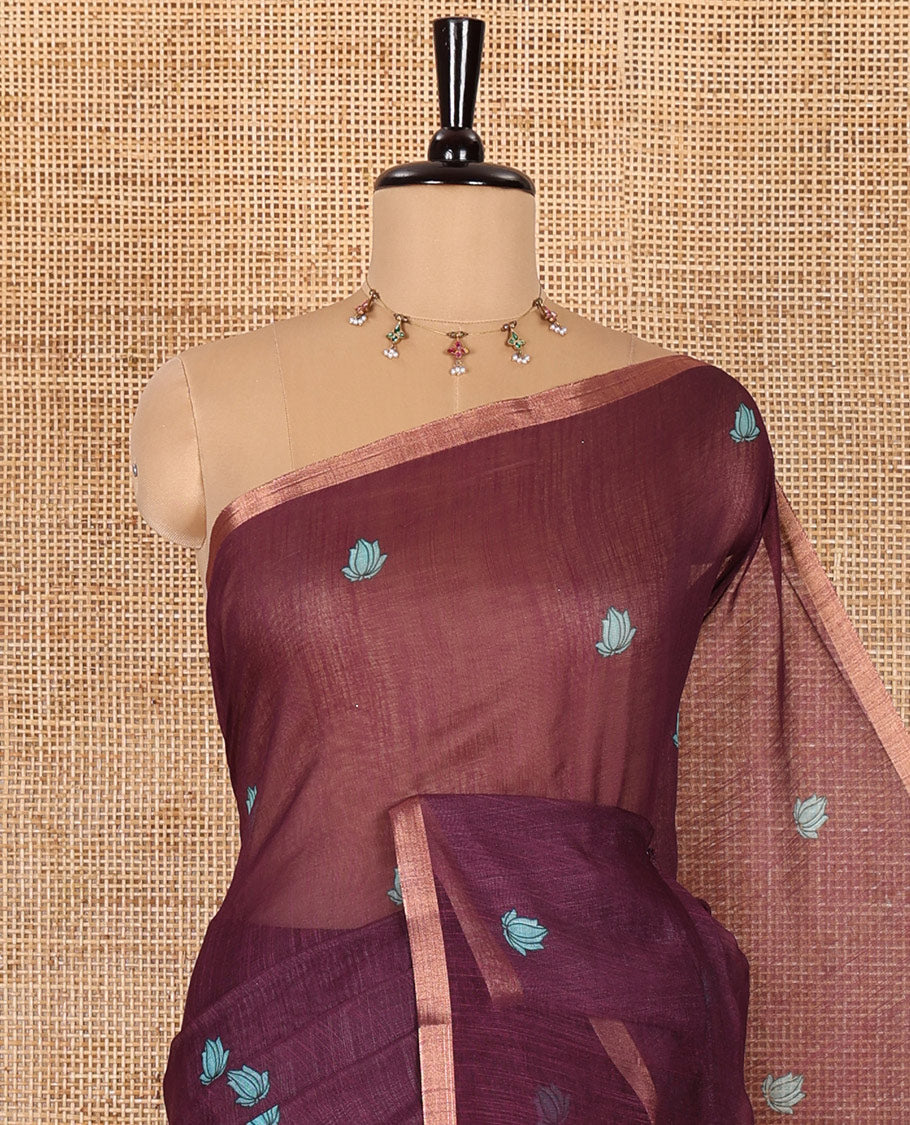 Wine lotus motifs printed linen saree, piping border, contrast floral vine printed pallu, and contrast printed blouse