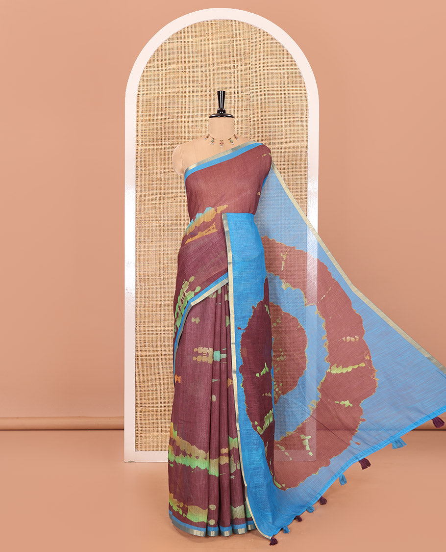 Maroon shibori printed linen cotton saree, contrast piping zari border, shibori circle printed pallu, and a contrast shibori printed blouse