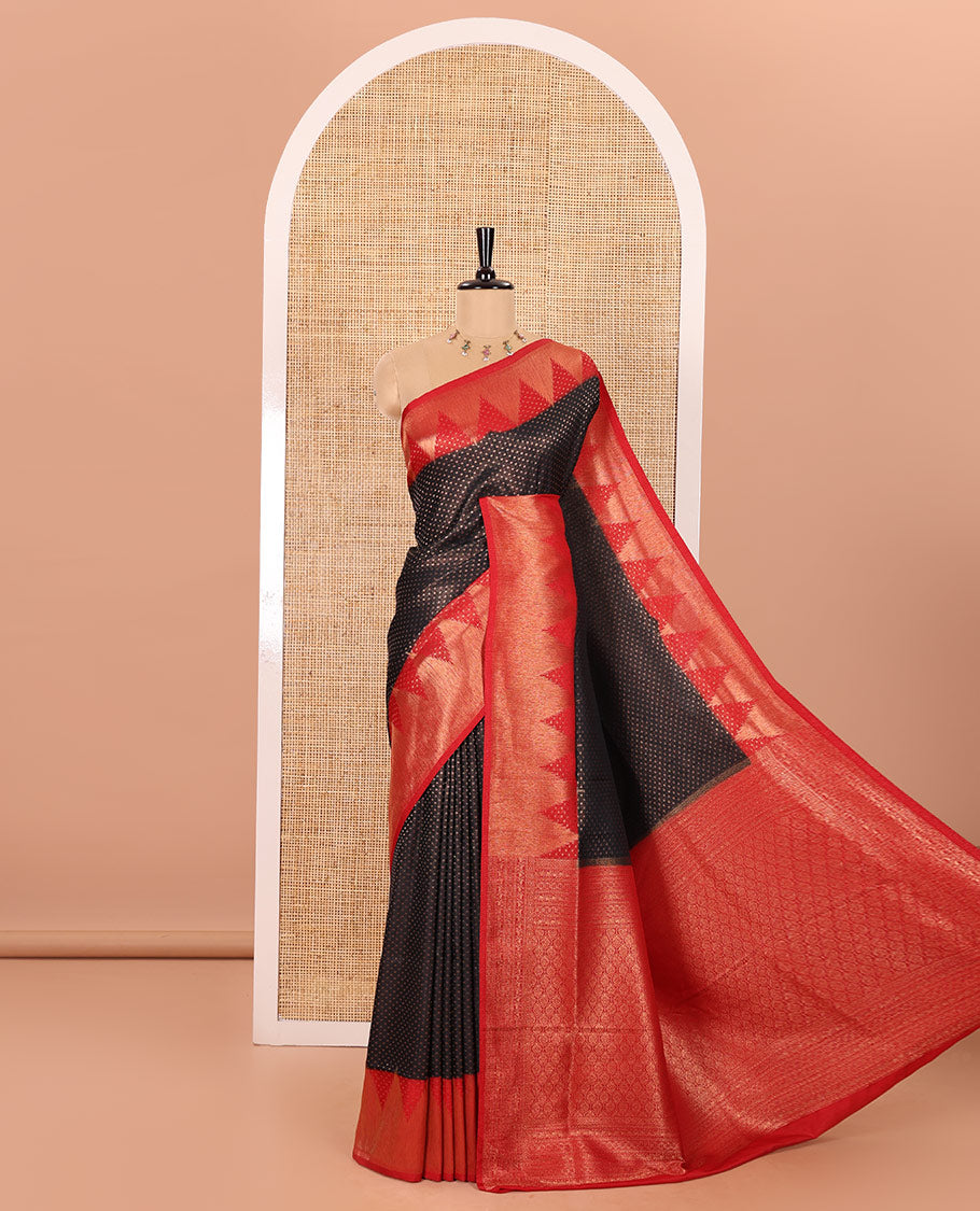 Black Luxury Soft Silk Saree Accentuated with 1000 Zari Buttas All Over Its Body, Complemented by a Contrast Temple Zari Border, Grandly Woven Pallu of Jaal Designs, and Paired with a Contrast Jacquard Blouse