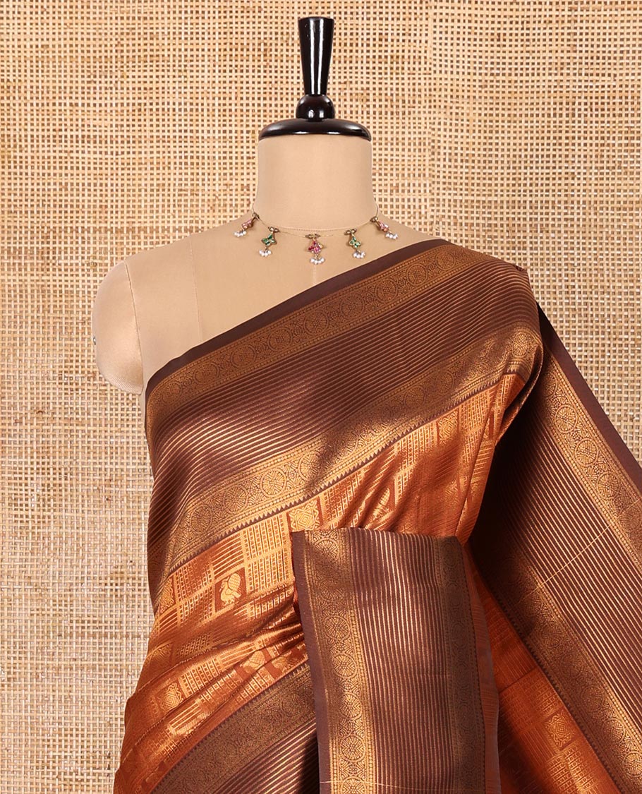 Rust Orange Kanchi Silk Saree, Accentuated with Zari Jacquard Design All Over Its Body, Complemented by a Contrast Traditional Zari Border of Chakram Designs, Majestically Detailed Pallu, and Paired with a Contrast Blouse