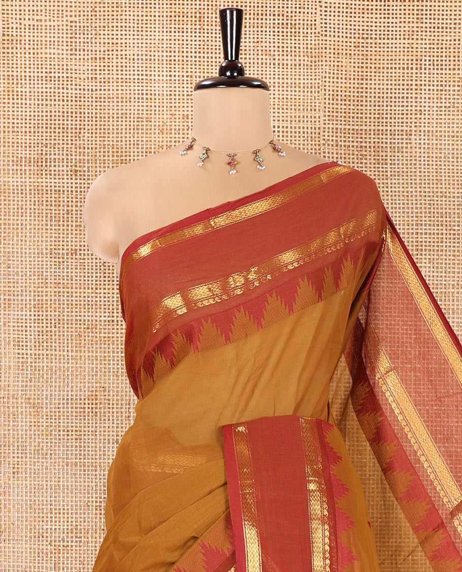 Mustard Chettinad Cotton Saree, Subtly Sparkled with Thread Buttas All Over Its Body, Complemented by a Contrast Border Rettai Pettu Border of Paisley and Chevron Stripes, Subtly Designed Pallu, and Paired with a Matching Blouse
