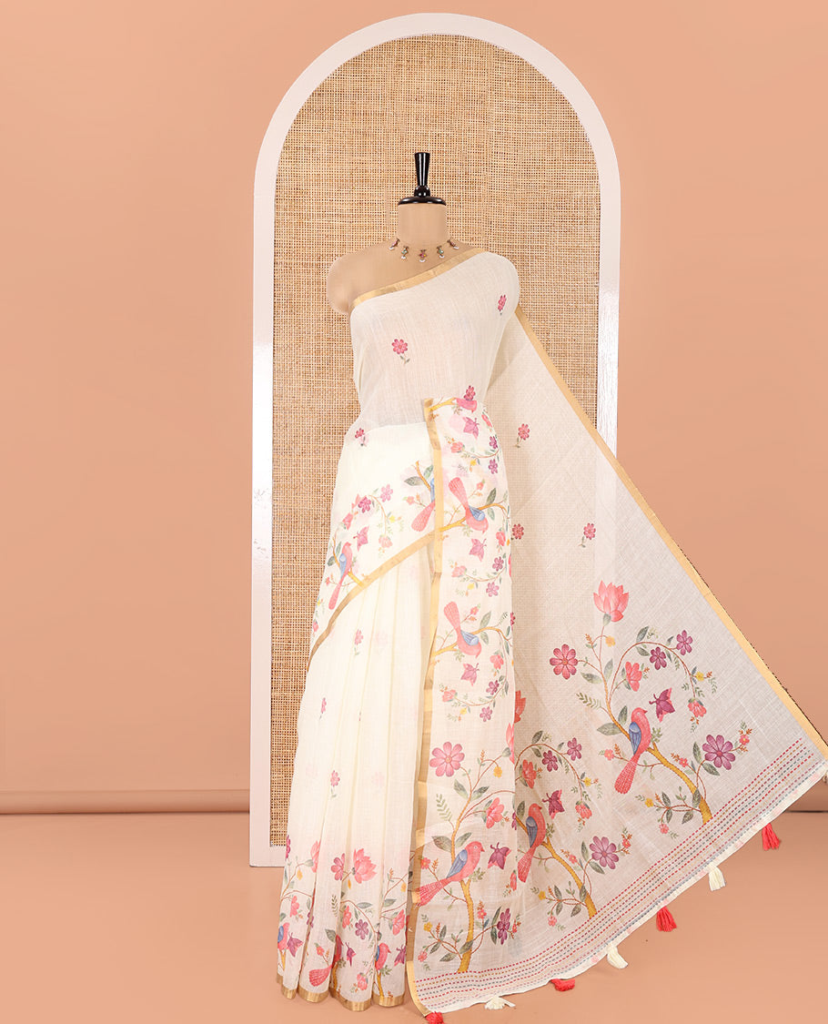 Cream Linen Cotton Saree, Artfully Detailed with Flower Motifs Printed On Its Body, Highlighted by Zari Piping Border of Floral-Bird Motifs Print, Pallu of Same Print, and Paired with a Printed Blouse