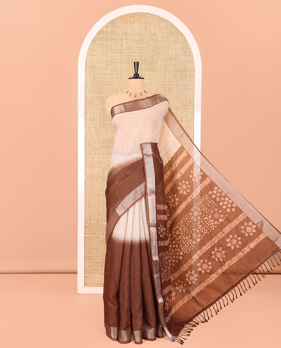 Chikku and Brown Linen Cotton Saree, Subtly Designed with Half-And-Half-Style Dual-Color Dye on Its Body, Complemented by a Contrast Bavanji Border, Pallu of Batik Print, and Paired with a Contrast Blouse