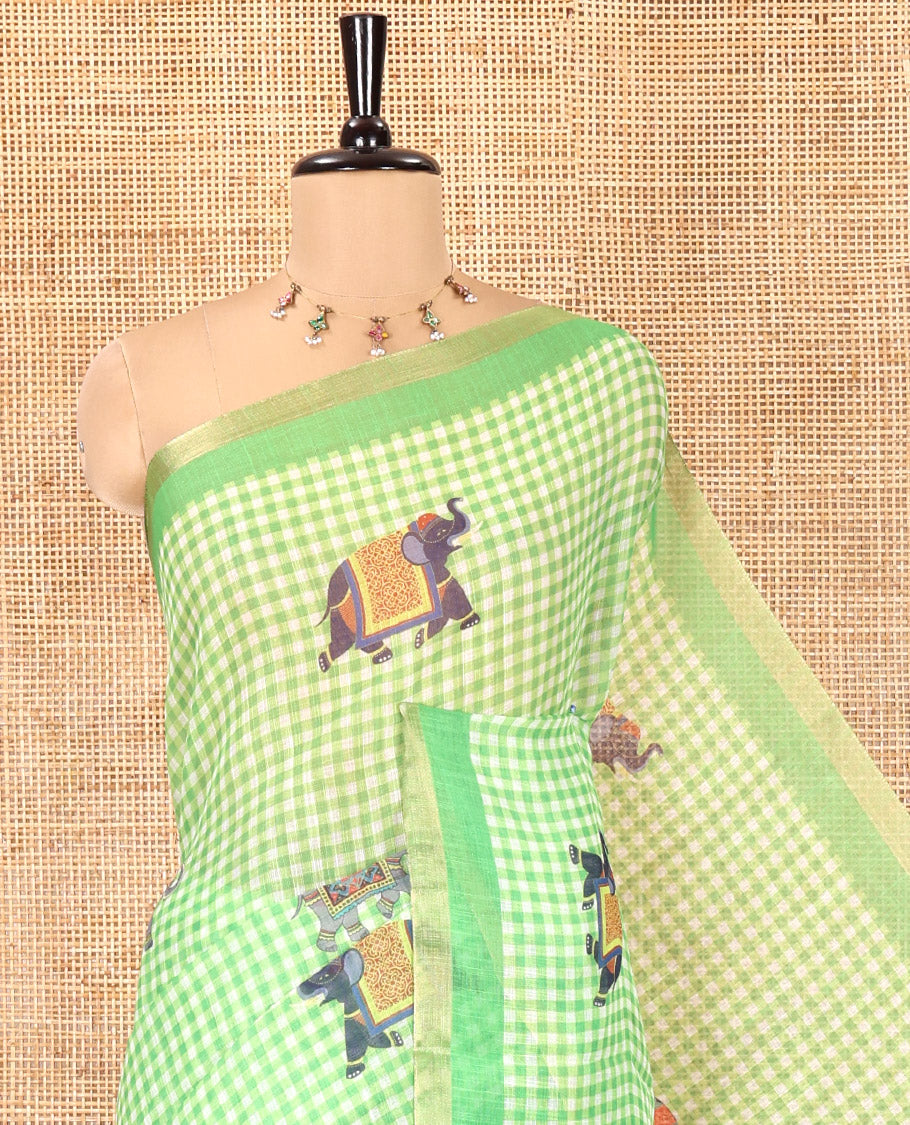 Green Linen Cotton Saree, Decked Up with Micro-Checks and Elephant Motifs on Its Body, Complemented by a Contrast Border, Striped Pallu, and Paired with a Contrast Elephant Motifs Printed Blouse