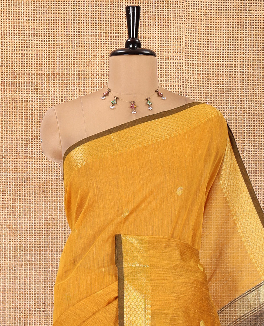 Mustard Maheshwari Cotton Saree, Flower Buttas All Over Its Body, Highlighted by Zari Border, Pallu of Contrast Floral Buttas, and a Contrast Blouse