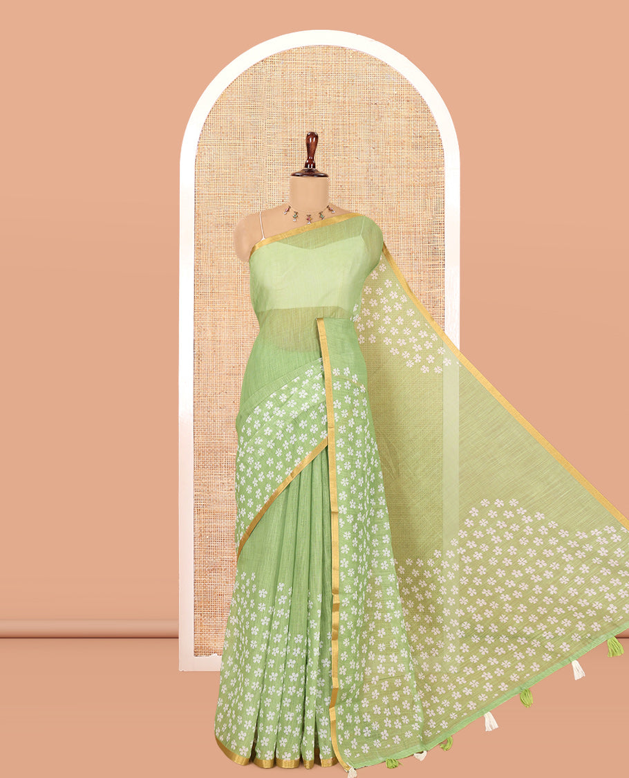 Green Linen Cotton Saree Features Half-And-Half-Style Flower Motifs Print, a Piping Border, and a Matching Blouse
