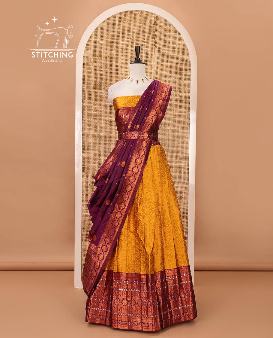 Mustard semi-banaras half-saree, embossed & contrast traditional zari border skirt,blouse of embossed & zari work & contrast-magenta zari design dhavani