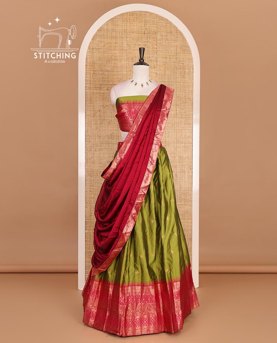 Green taffeta silk half saree, zari buttas with contrast red traditional zari border skirt, matching zari design blouse, and contrast plain zari border syska georgette dhavani
