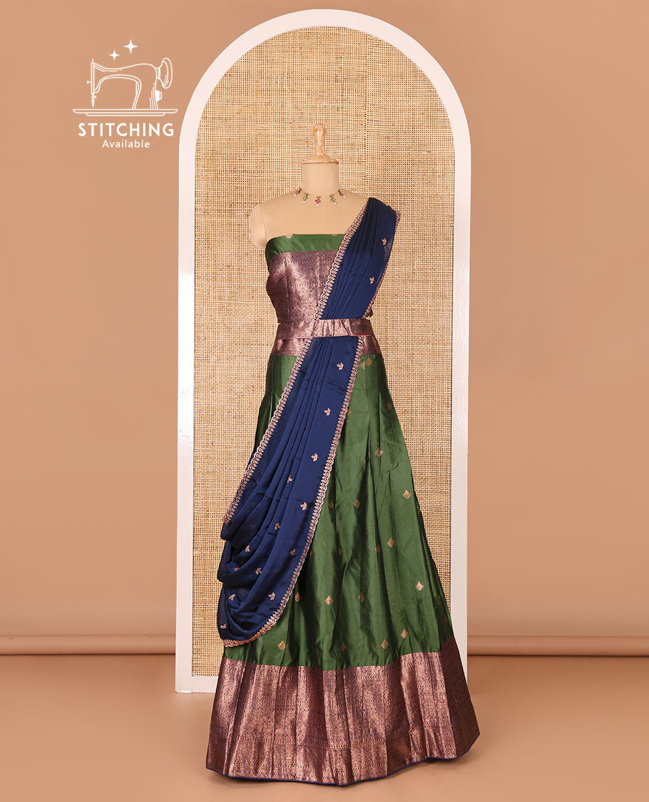 Bottle green taffeta silk half-saree, zari buttas and contrast traditional zari bordered skirt, a matching blouse, and contrast embroidered satin georgette dhavani
