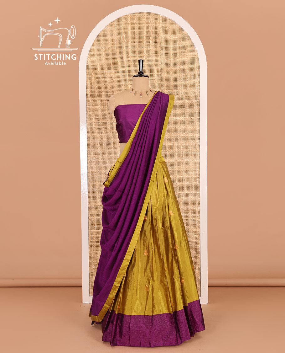 Yellow and pink half-saree, buttas with traditional zari bordered taffeta silk skirt, a plain blouse, and a contrast vichitra silk dhavani