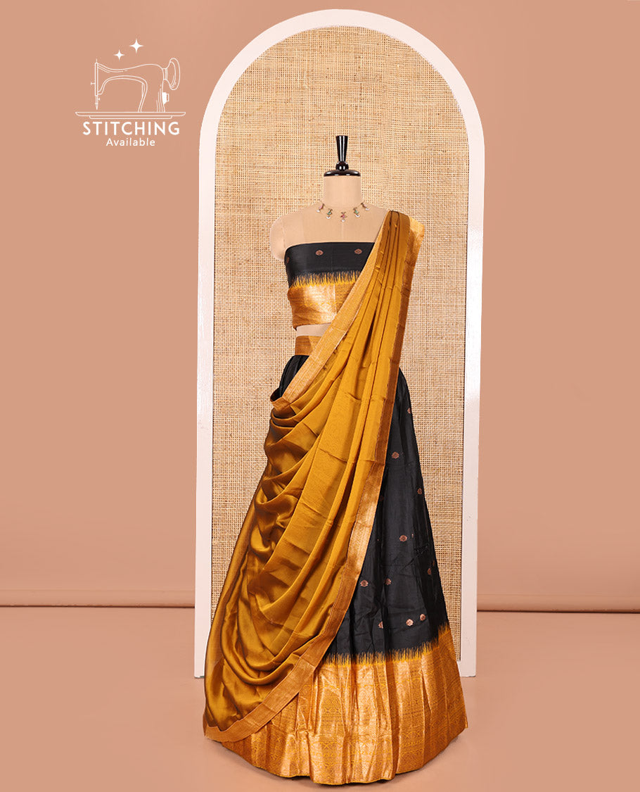 Black and Mustard Semi-Banaras Half-Saree Featuring Zari Buttas All Over the Skirt, Accentuated with a Contrast Traditional Zari Design Border, Paired with a Matching Blouse, and Has a Plain Syska Georgette Dhavani with a 4-Sided Zari Border