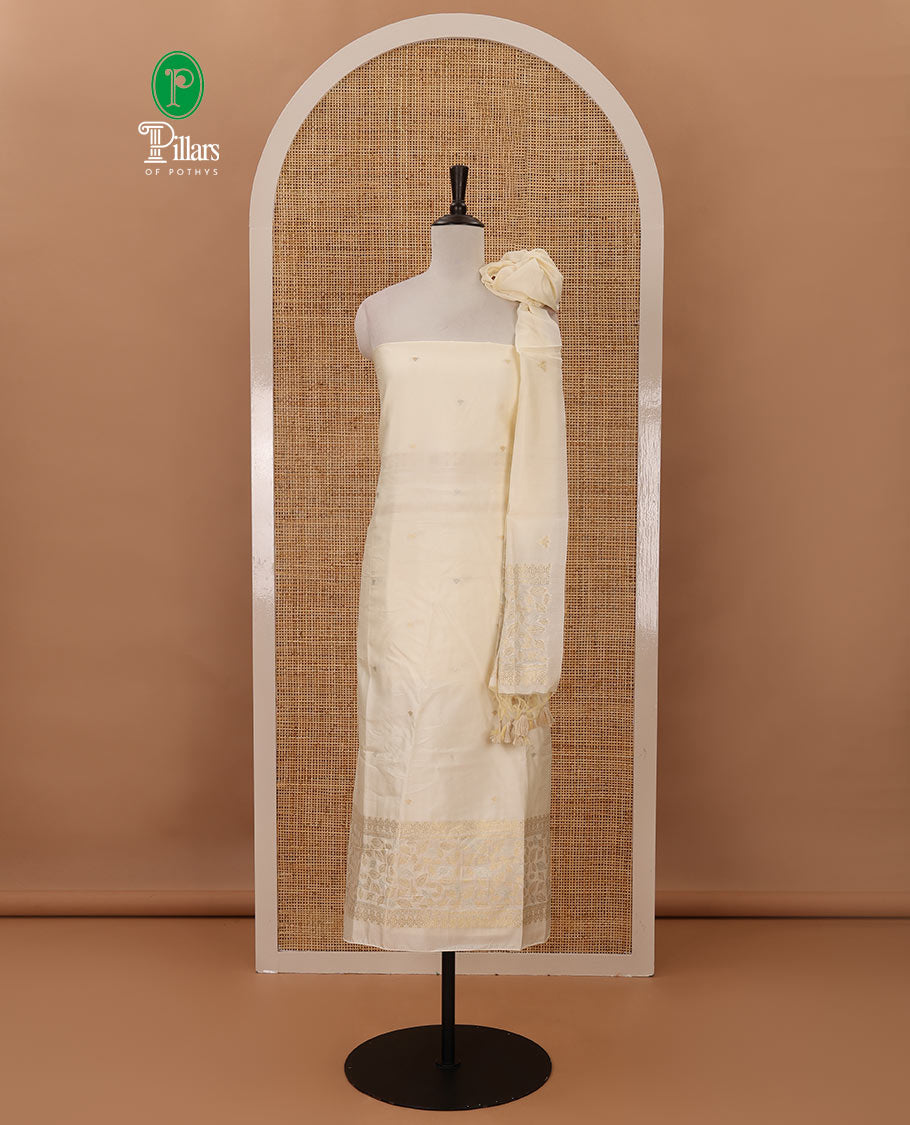Kerala cream chudidar material, zari buttas & leaf motif taffeta silk top, plain cream santoon bottom & leaf zari designs dupatta