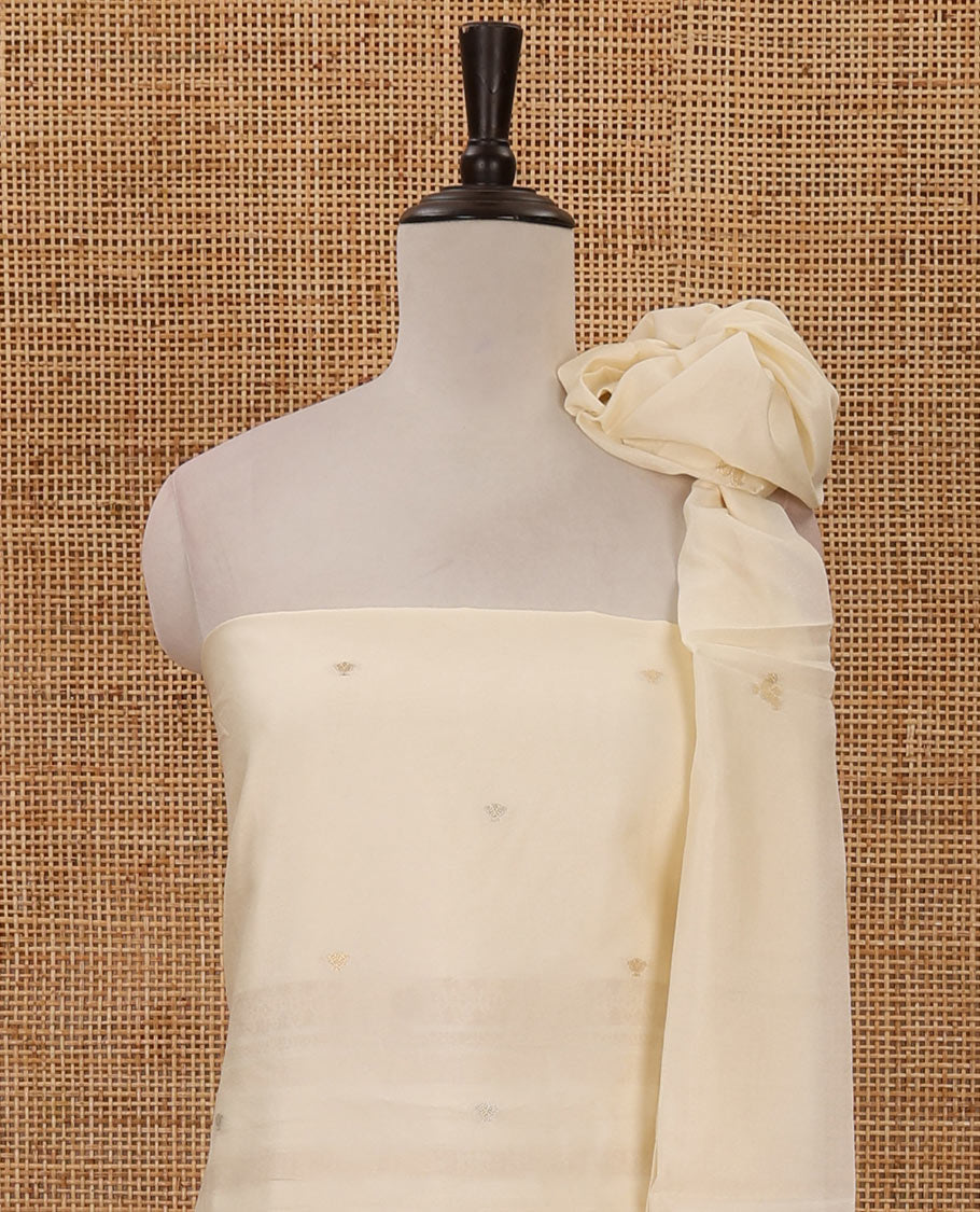 Kerala cream chudidar material, zari buttas & leaf motif taffeta silk top, plain cream santoon bottom & leaf zari designs dupatta