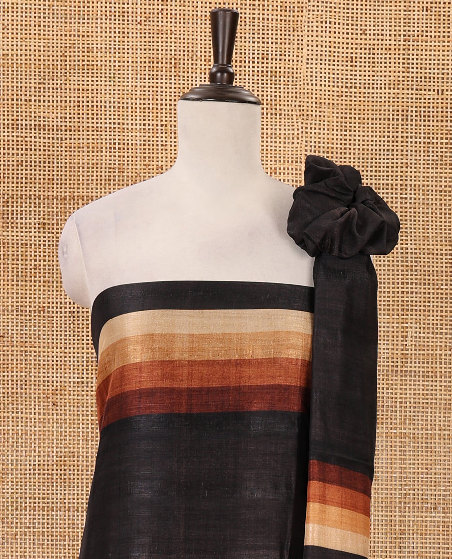 Black material chudidar set, horizontal brown-ombre striped semi-tussar top, plain santoon bottom & horizontal brown-ombre striped dupatta with tassels